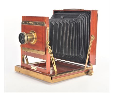 An early 20th Century mahogany and brass whole-plate Thornton-Pickard 'Crown' Triple Extension Field Camera,  focusing screen