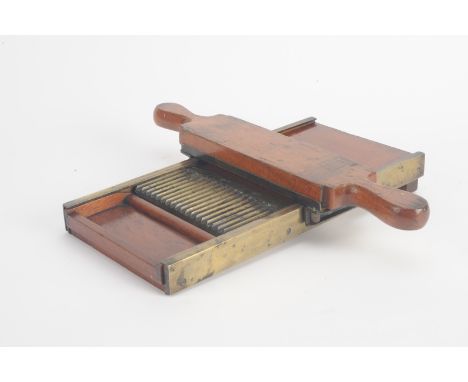 A 19th Century mahogany and brass Pill Roller,  330mm long, G (2)