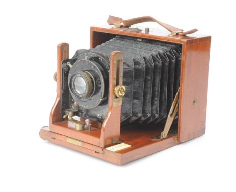 An early 20th Century mahogany and brass quarter-plate Hand and Stand Camera, with Beck Neostigmar Series III lens in Bausch 