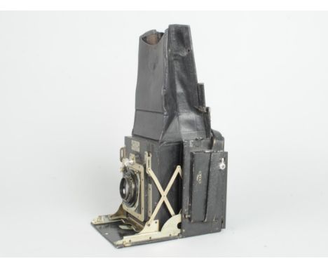 A Newman &amp; Guardia Folding Reflex Plate Camera, serial no. FR 563, body F, small light leaks to hood, mirror present, foc