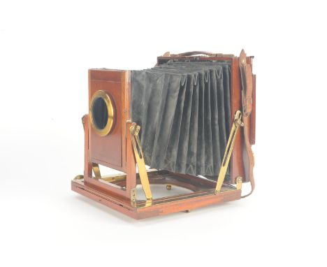 An early 20th Century mahogany and brass half-plate Thornton-Pickard 'Amber' Field Camera,  with septum slot, lens board fitt