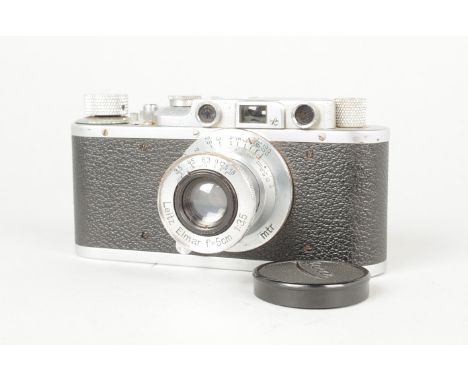 A Leitz Wetzlar Leica II Camera, serial no. 302 671, 1938, body F-G, corrosion specks to chrome, shutter working but noisy, w