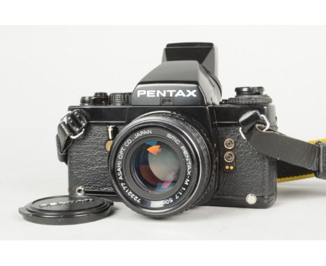 A Pentax LX SLR Camera, serial no. 5 236 384, with FB-1 finder base and FC-1 eyepiece, body G, wear to baseplate, shutter wor