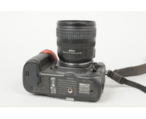 A Nikon D300 DSLR Camera, serial no 8032983, powers up, appears to function as should, body G, some wear to grips, light mark