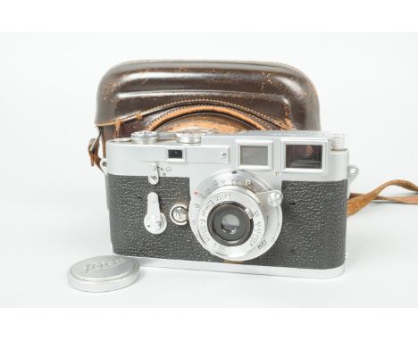 A Leitz Wetzlar Leica M3 Double Stroke Camera, chrome, serial no. 749 305, 1955, early triangular strap lugs, body F-G, Leica