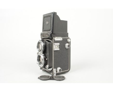 A Minolta RA TLR Camera, serial no 360239, shutter working, body VG, with 75mm f/3.5 Rokkor lens, elements G, fungus, with ca