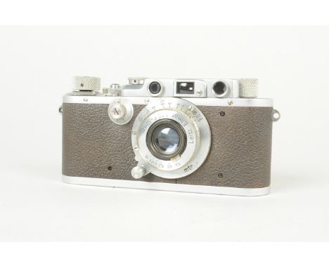 A Leitz Wetzlar Leica IIIa Camera, serial no. 255 560, 1937, body G, shutter sticking, with a Leitz Elmar 50mm f/3.5 collapsi