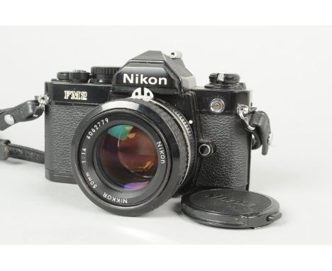 A Black Nikon FM2 SLR Camera, serial no. 7 148 238, body G, shutter working, meter reacts to light, with a Nikkor 50mm f/1.4 