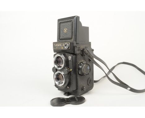 A Yashica Mat 124 G TLR Camera, serial no 231818, body G-VG, light marks, shutter working, meter untested, with Yashinon 80mm