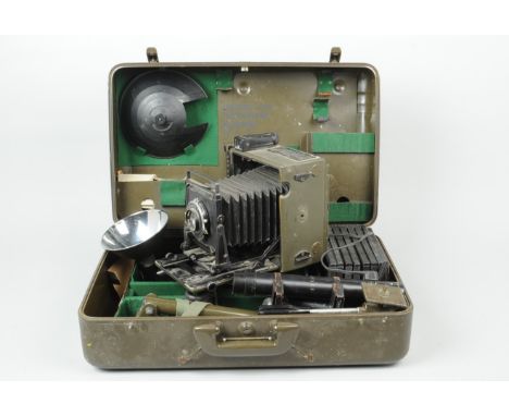 A Graflex 5 x 4 Pacemaker Speed Graphic Military Camera KS-4A(1) Outfit, olive drab, U.S. Signal Corps camera designation KE-