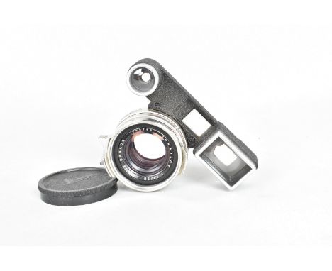 A Leitz Canada Summilux 35mm f/1.4 Lens with 'Spectacles', serial no. 1765793, barrel VG-E, some slight oil residue on iris, 