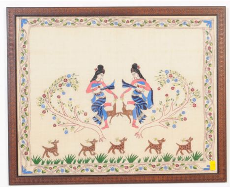 A vintage 1970's framed and glazed Indian embroidery with multi coloured thread depicting two females dancing and feeding dog
