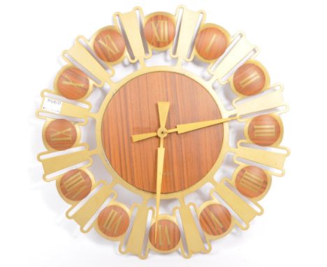 Estyma - A vintage 20th century Estyma wall mounted clock. The clock having brushed brass hands with roman numeral set to cha
