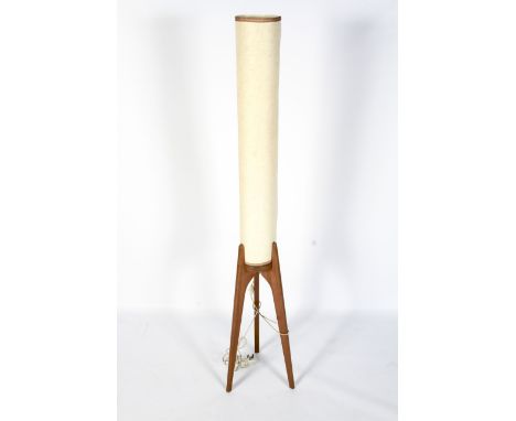 A 1960s tripod shaped rocket floor lamp. With cream cylindrical shade, on flared teak supports, electrified, 167cm high overa