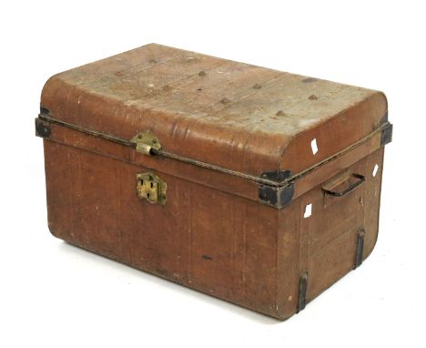 An early 20th century metal trunk. With black painted clamps and a brass lock, handles to either side, L67cm x D42cm x H42cm