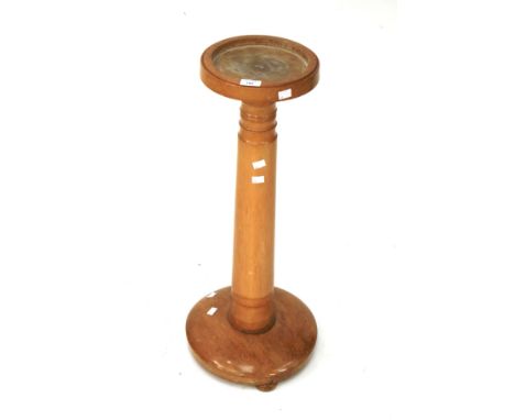 A light oak torchere plant stand. On turned column. 79cm high.