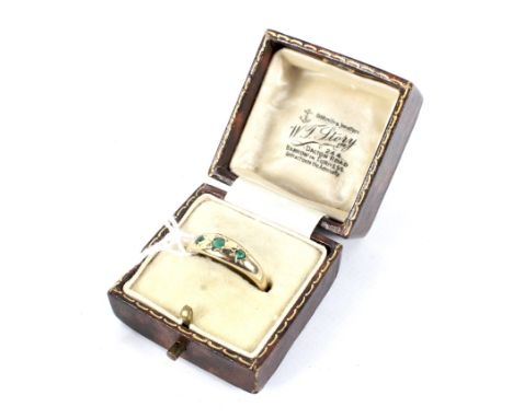 Amendment: The stone is not emerald. A 20th century yellow metal and chrysoprase ring. Stamped '375', the band set with three