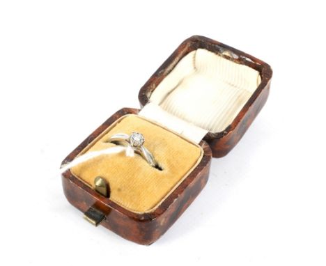 A 20th century white metal solitaire diamond ring. Stamped '375', the brilliant cut diamond in an illusion setting, size N/M,