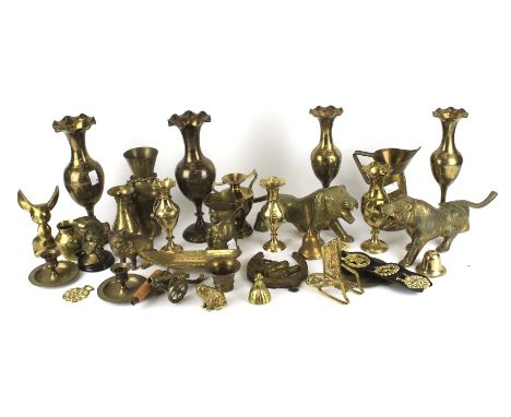 An assortment of copper and brassware. Including two pairs of vases, animal figures, a candlestick, horse brasses, etc