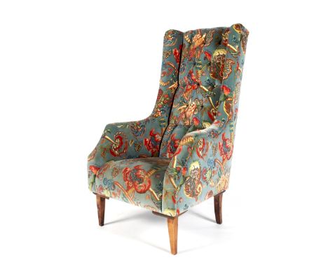 A contemporary oversized high button back armchair. Upholstered with blue velvet printed with exotic birds, flowers and leave