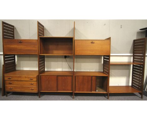 A mid-century Simplex stacking unit. Comprising: four units with ladder sides, one unit with fall front cupboard above three 