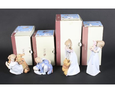 Four Nao Disney collection figures. All Winnie the Pooh characters, in the original boxes tallest 23cm high.