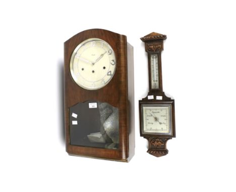 A vintage 1930s Kienzle pendulum wall clock and a 20th century barometer. The wall clock with a silvered dial with Arabic num