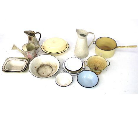 A quantity of assorted vintage kitchen enamel ware. Including a large saucepan 25cm diameter, dishes, plates and a water jug,