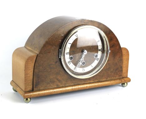 A Westminster chiming mantel clock. Walnut veneer, with German movement, case marked C.W.S. Ltd.,London, on ball feet. With k