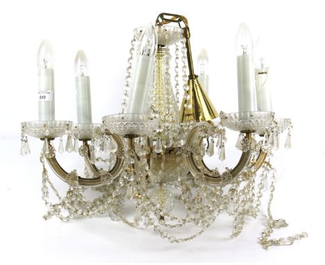 An electric chandelier ceiling light. With six branches, glass drops and swags. 40cm high and 55cm diameter.