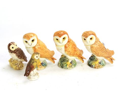 A parliament of five owls. Comprising four Beswick owls (the largest three each 11.5cm high) and another by Goebel