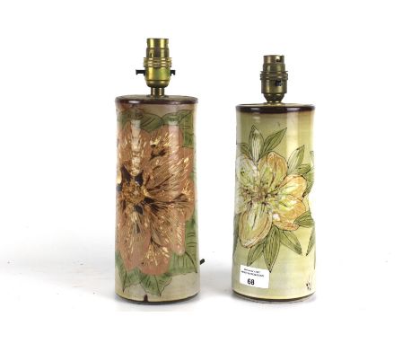 A pair of 20th century studio pottery lamp bases. Of cylindrical tapered form, decorated with flowers and marked 'KN', 22cm h