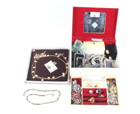An assortment of costume jewellery. Including a chain necklace, enamel brooches, rings, St Christopher pendant, earrings, etc