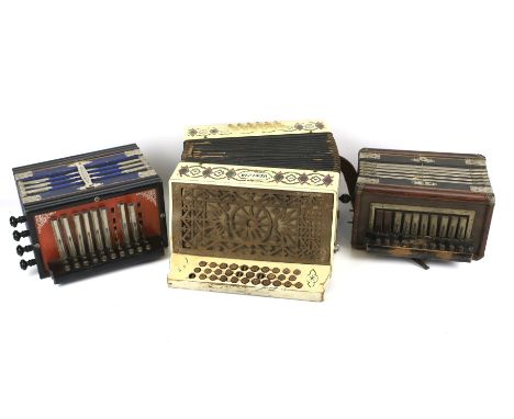 Three assorted button accordions. Including 'The charmer', Antoria 'Champion Band' and a 'Venezia'.L32cm x D18cm x H34cm