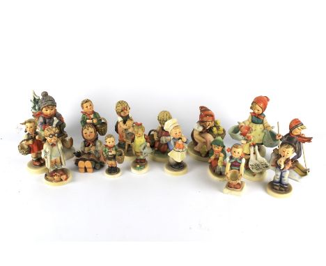 Seventeen Goebel Hummel figurines. Featuring children holding baskets, skiing, etc