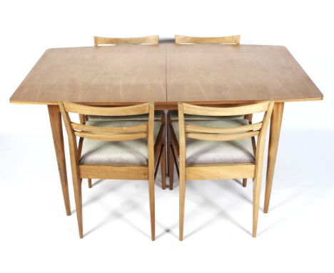 A McIntosh 1960s teak rectangular extending dining table and four dining chairs. The table on four tapering supports, with ad