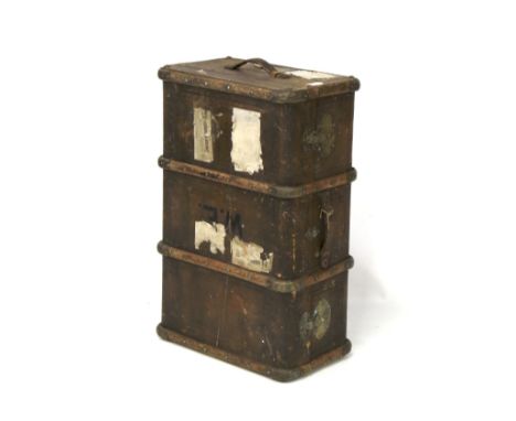 A vintage travelling trunk. With handles to either side and covered with fabric, 81cm long