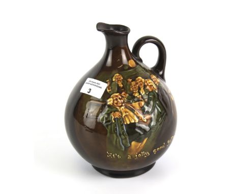 A Royal Doulton jug titled 'He's a jolly good fellow '. 20cm high Condition Report: Generally in good condition. No obvious c