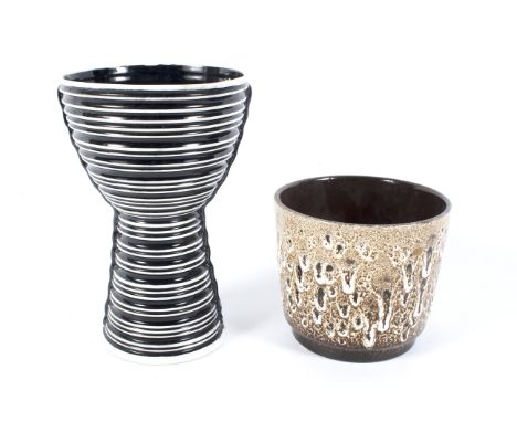 A Sylvac and a West German vase, circa 1960. Impressed marks, the footed Sylvac vase ribbed in black and white, the cylindric