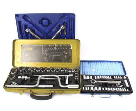 An assortment of tools. Including a socket set, some in fitted boxes