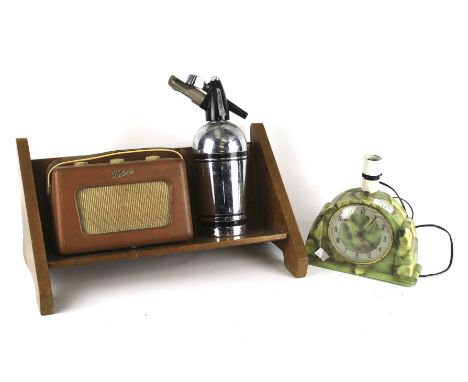 Four assorted vintage household items. Including a 'Metamec' mantel clock with attached light fitting, a wooden book stand L4