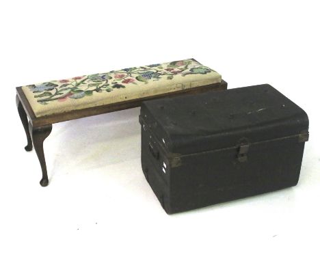 A green Japanned travelling trunk and an embroidered top footstool. The footstall measuring L94 x D36 x H35cm