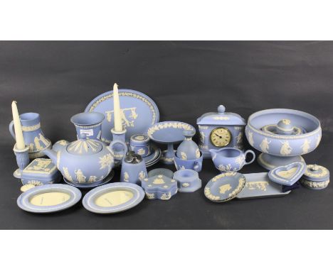 A quantity of assorted Wedgwood Jasperware. Including a teapot, candlesticks, picture frames, trinket boxes and a clock, etc.