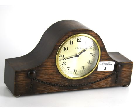A Swiss made Fontainemelon eight day mantle clock. Napoleon hat style with platform escapement, Arabic numbers and wooden cas