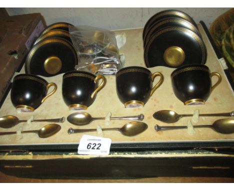 Cased part set of Royal Worcester black and gilt coffee cups with saucers together with six silver gilt spoons