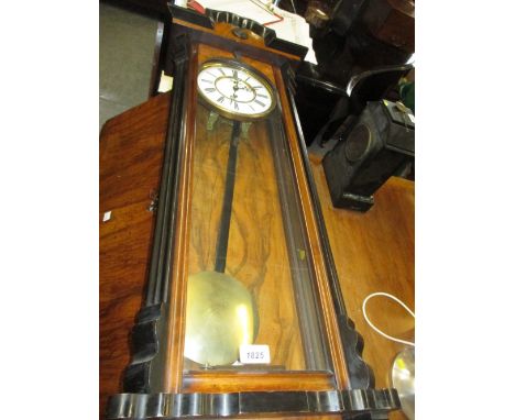19th Century figured walnut and part ebonised Vienna style wall clock, the enamel dial with Roman numerals and subsidiary sec