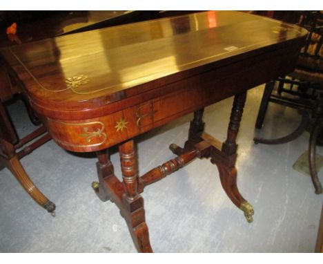 19th Century rosewood brass inlaid D-shaped fold-over baize lined card table, raised on twin turned end column supports, unit