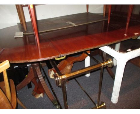 George III mahogany D-end dining table, the reeded top with a single extra leaf raised on ring turned column supports with re