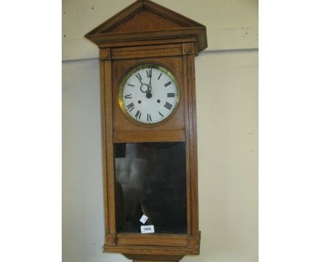 Early 20th Century oak cased Vienna style wall clock, the enamel dial with Roman numerals with two train Buren movement strik