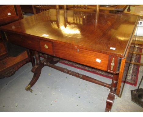 Regency rosewood rectangular drop-leaf sofa table, the figured top above two frieze drawers raised on turned tapering support